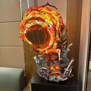Figurine Luffy Red Rock avec des effets de feu et détails spectaculaires sur socle décoratif