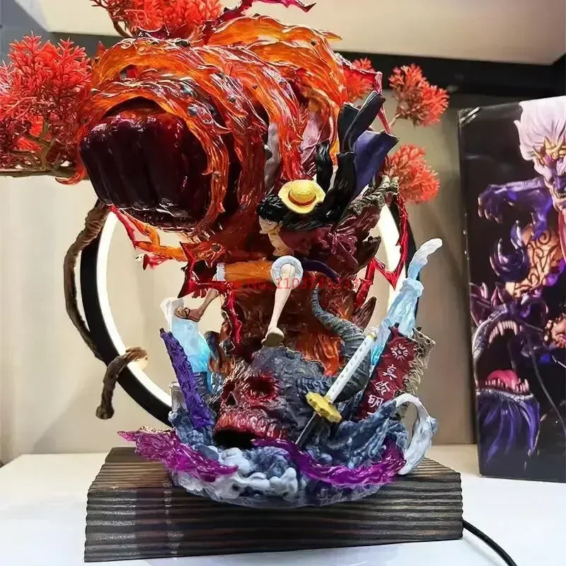 Figurine Luffy Red Rock en action avec des effets de feu et de vagues dynamiques