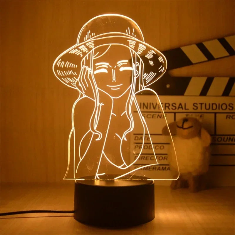 Veilleuse 3D One Piece représentant un personnage joyeux avec un chapeau sur une base noire
